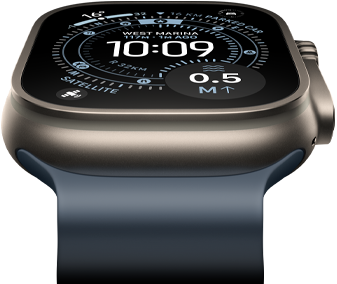 Apple Watch Ultra 3 tilted forward, natural titanium case, compass on Orienteering watch face, anchor blue Ocean Band