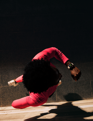 A person checks progress on Apple Watch Series 11 Workout app while running