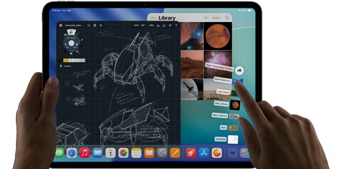 iPad Pro, space black colour, left hand holding device, right hand pointing gesturing to manipulate multiple open app windows, a drawing app with sketches of mechanical designs, photos library of planets and space images, downloads folder files fanned out