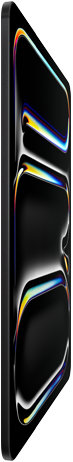 iPad Pro, front exterior, space black colour, aluminium and glass enclosure, thin profile, tilted back with display showing multicoloured line art