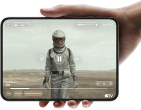iPhone Duo, held with one hand, opened in horizontal orientation, fully unfolded, interior screen displays Apple TV show