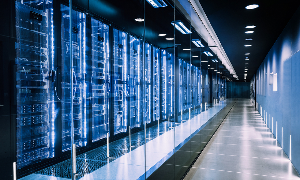 A long row of server racks in a data centre.