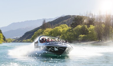 A group of people on a speedboat.