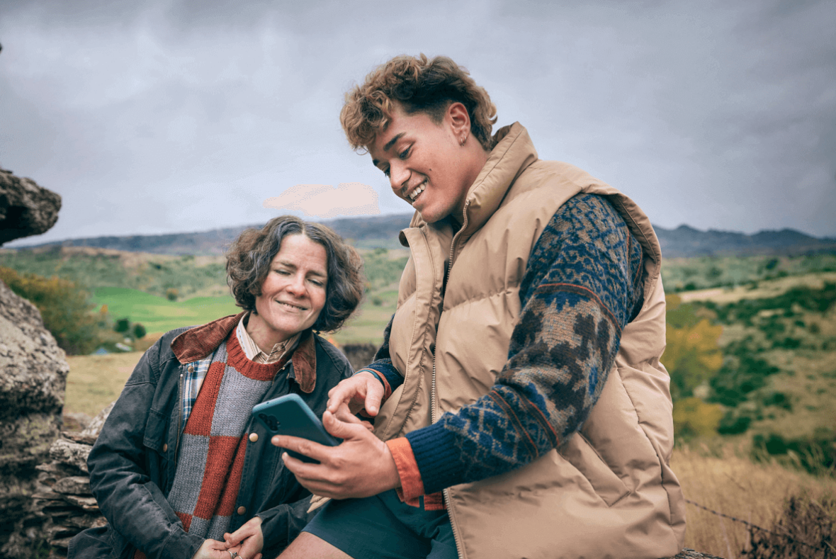 Scottish Mum and Jade on Stone Wall with a phone