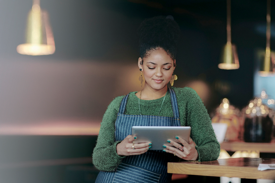 Lady using iPad at her business