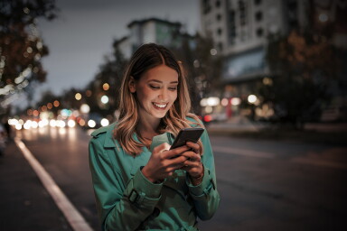 Beautiful woman using smart phone, portrait.