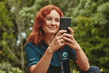 Pepper using her phone outdoors
