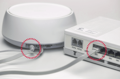 Smart WiFi router connected to a modem via Ethernet cables, showing highlighted ports for easy setup.