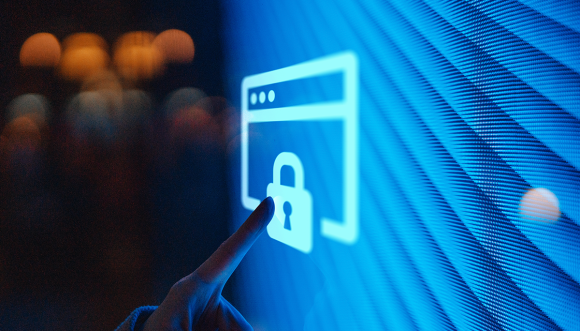 A finger pointing at a screen