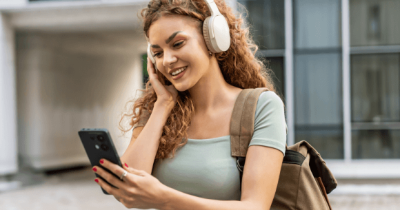 A young woman using a One NZ Pass on her phone.