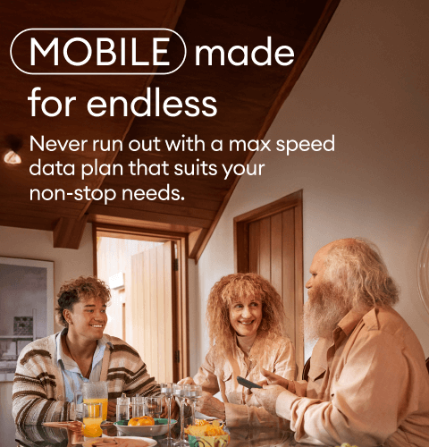 Jade and Mum and Dad at Dining Table smiling