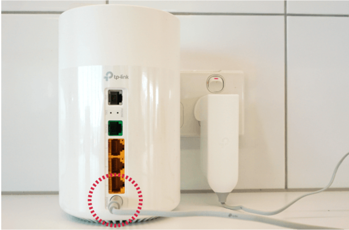 Power adapter plugged into Deco-X53 DSL modem.