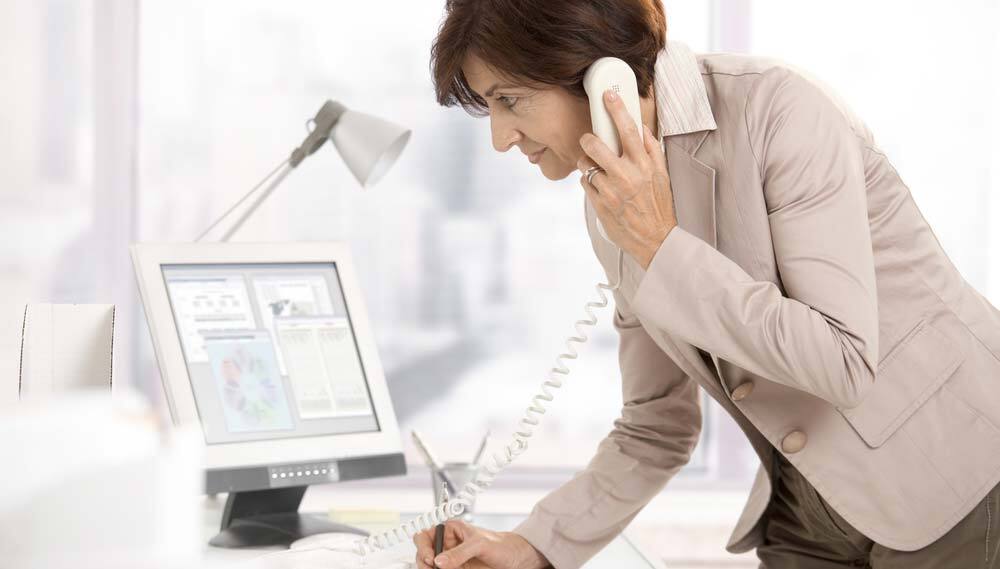 Lady talking on phone in an office
