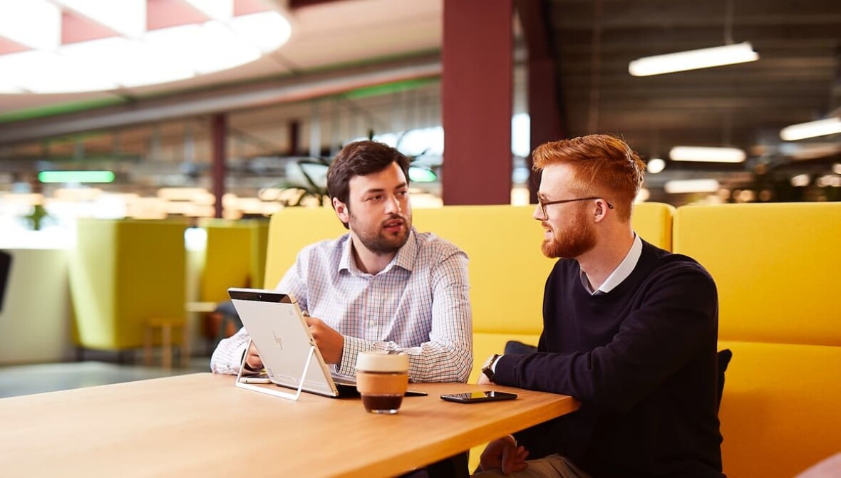 2 gentlemen talking business in cafe