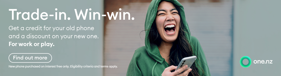 A laughing woman, feeling triumphant with her new phone.