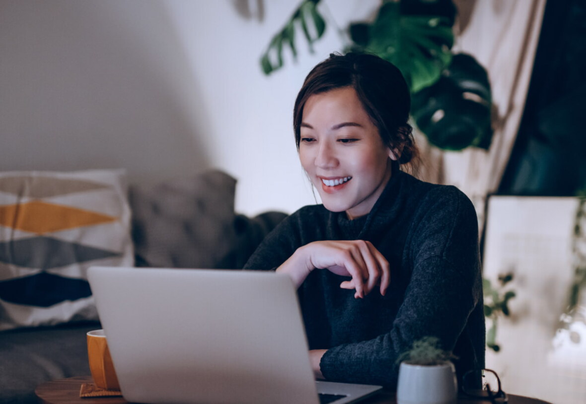 lady with black hair looking at computer