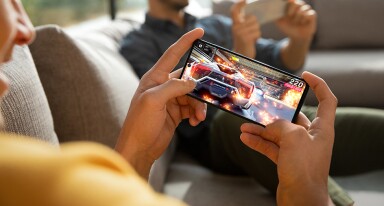 Man playing game on his mobile phone.