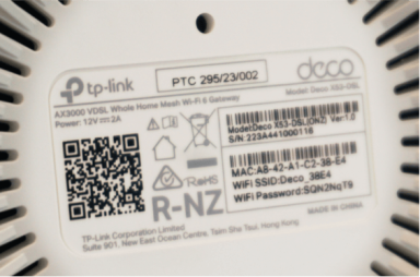Base of a deco X53 modem showing WiFi login details