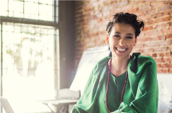 woman with long hair smiling