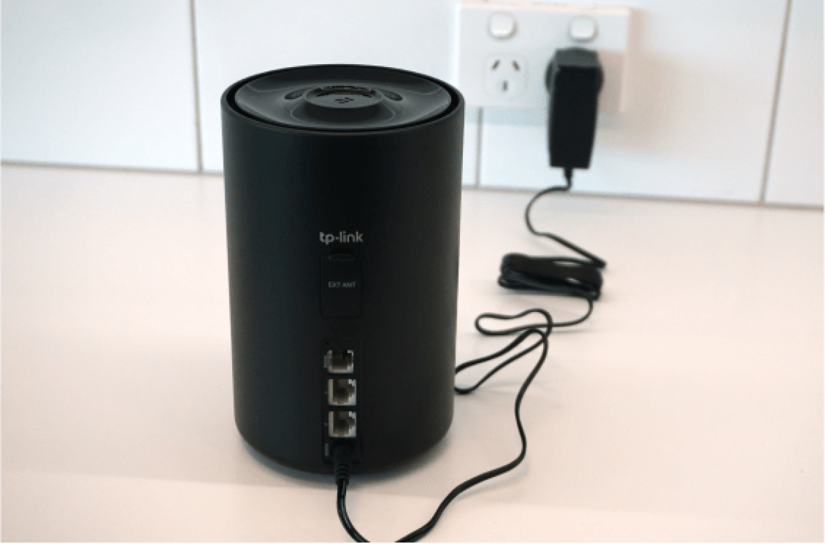 Power cable and adapter plugged into Dexo X58-4G modem.