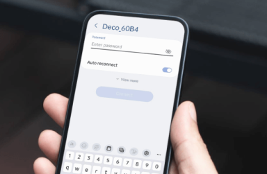 Hand holding a smartphone displaying a WiFi connection screen for "Deco_60B4".